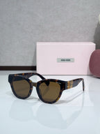 MiuMiu cat-eye sunglasses, tortoiseshell frames with brown tinted lenses