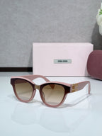 MiuMiu cat-eye sunglasses, pink frames with brown tinted lenses