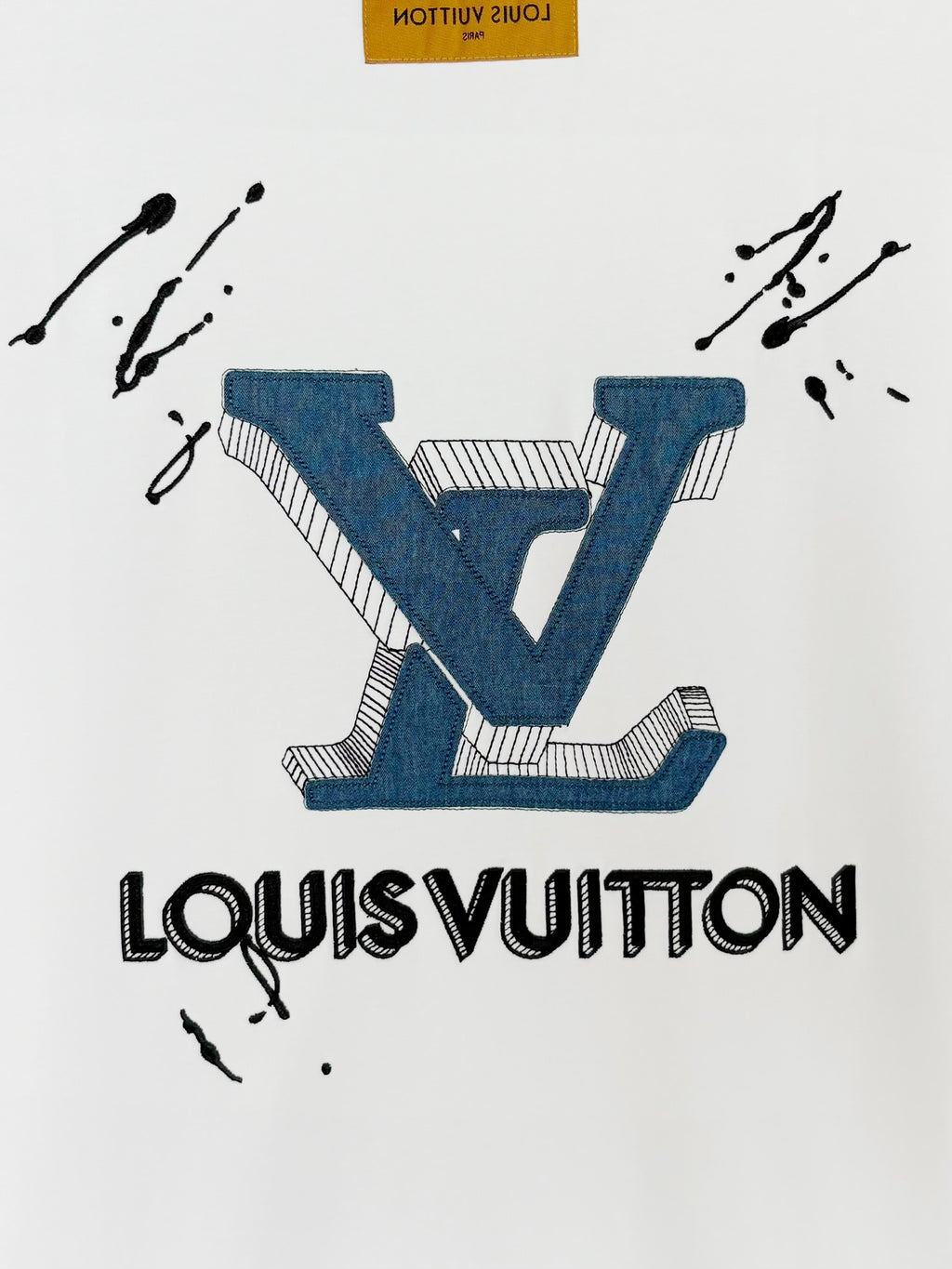 White Louis Vuitton T-shirt with centered Louis Vuitton wordmark and blue V
