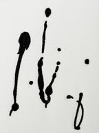 White Louis Vuitton T-shirt close-up of black scribble-style artwork print