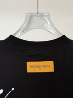 Black T-shirt back neckline with yellow logo label at center