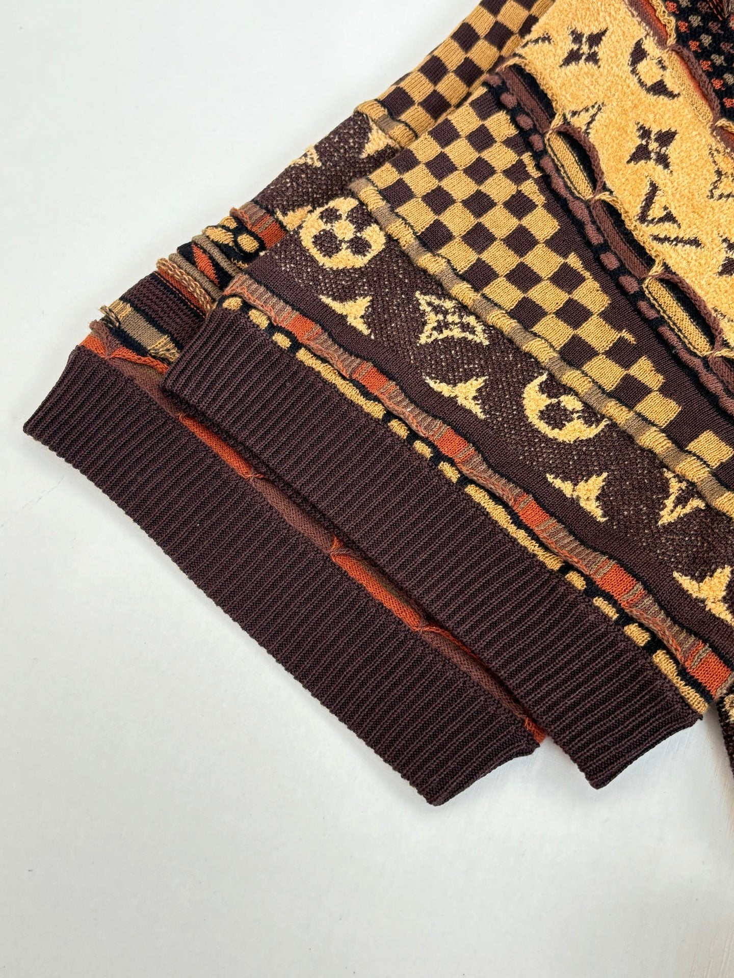 Louis Vuitton monogram shirt cuffs and ribbed hem, brown and gold with red accents