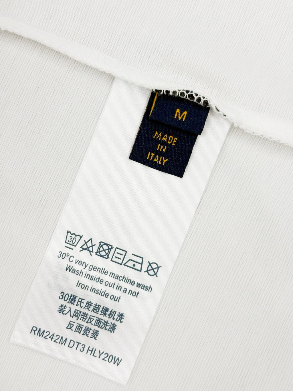 Louis Vuitton T-shirt care label with size, washing, and Made in Italy text