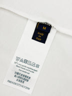 Louis Vuitton T-shirt care label with size, washing, and Made in Italy text