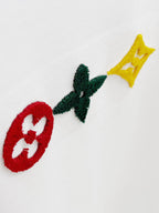 Louis Vuitton white T-shirt with embroidered red, green, and yellow motifs