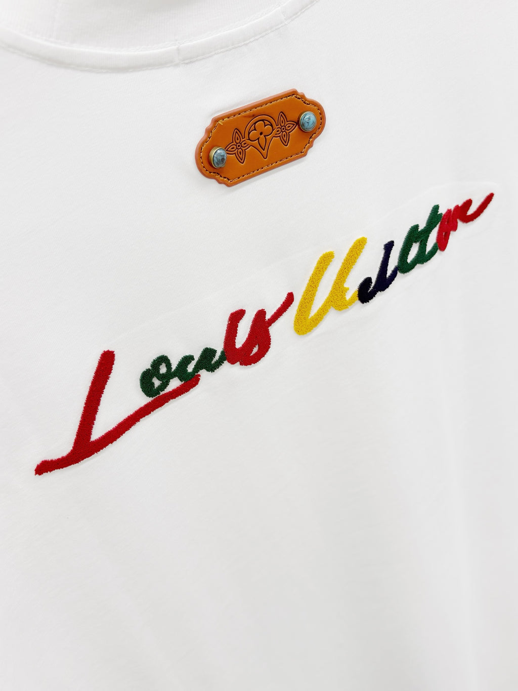 Louis Vuitton white T-shirt with embroidered tan patch and cursive logo