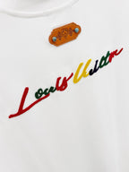 Louis Vuitton white T-shirt with embroidered tan patch and cursive logo