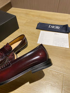 Burgundy leather loafer with flat sole and slip-on profile