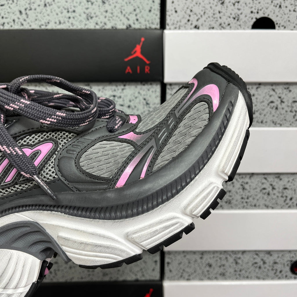 Unisex running sneakers side view, gray upper with pink accents and white midsole