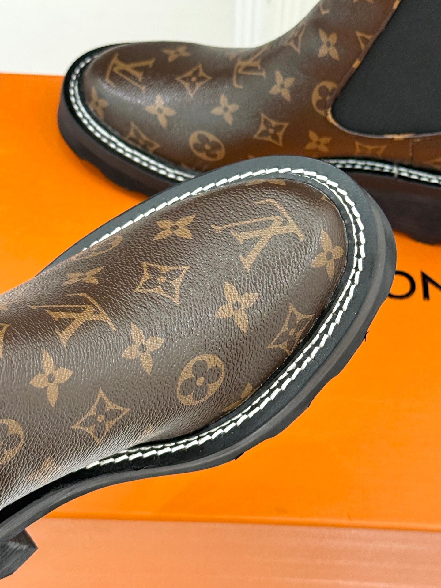 Louis Vuitton monogram chelsea boot toe and side with white edge stitching