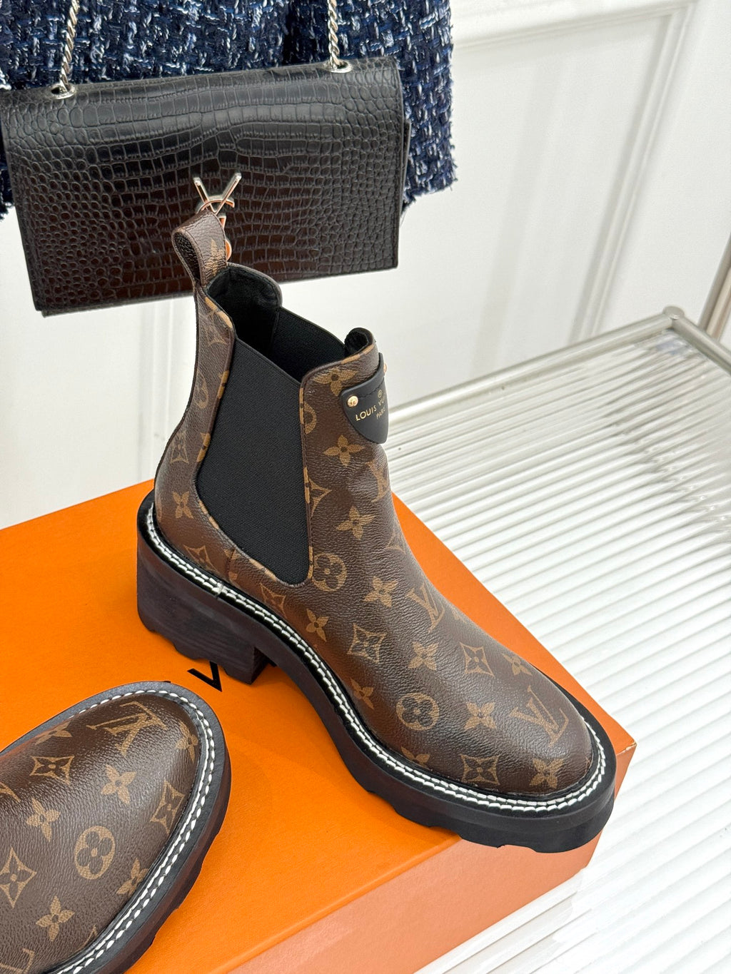 Louis Vuitton monogram chelsea boot pair with black elastic gore and rubber sole