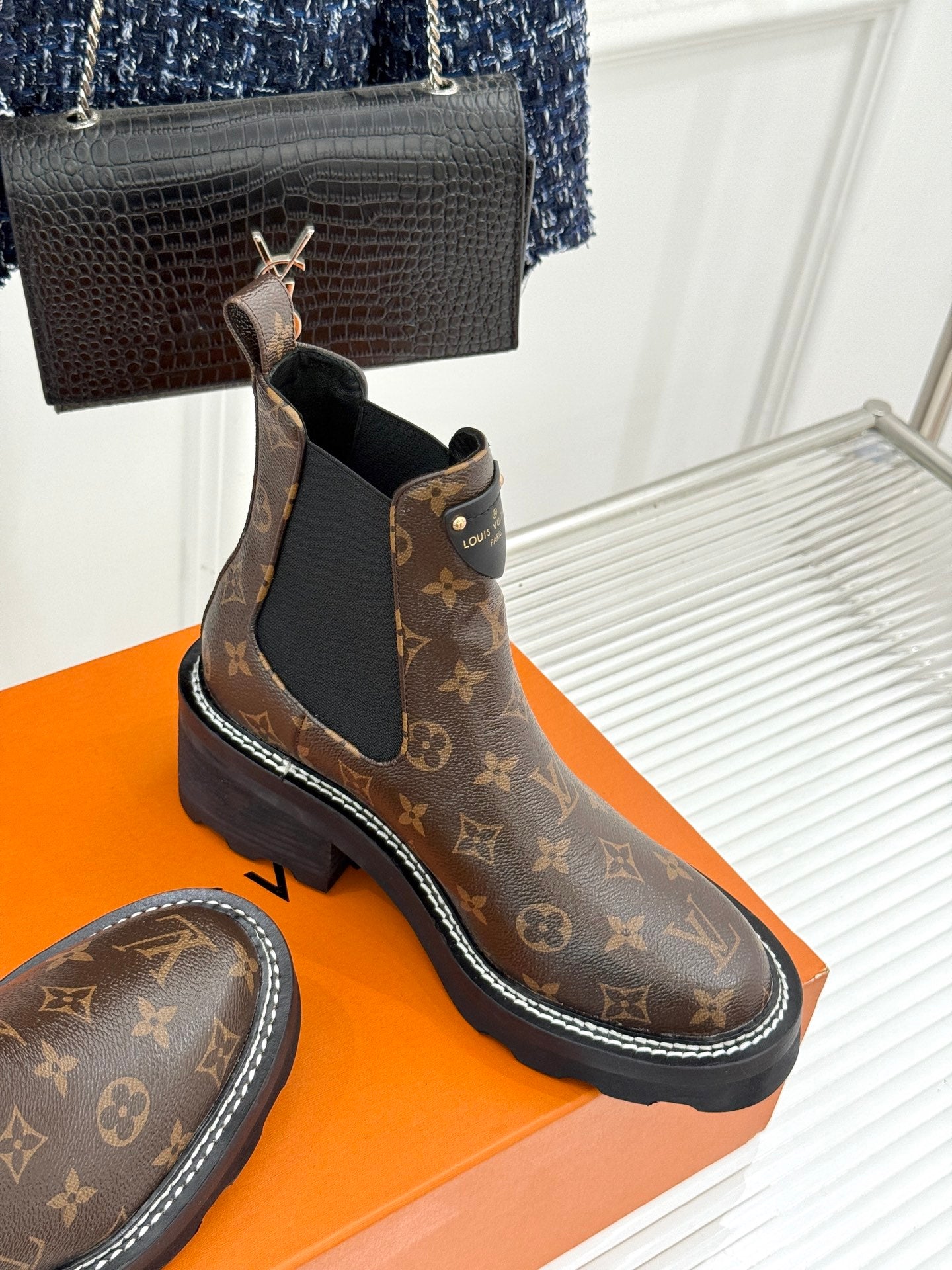 Louis Vuitton monogram chelsea boot pair with black elastic gore and rubber sole