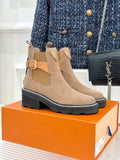Beige suede ankle boots with buckle strap, stitched edge sole, block heel