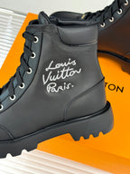 Black leather lace-up boot close-up with 'Louis Vuitton Paris' script