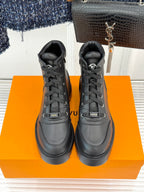 Black leather lace-up high ankle boots, front view, with padded collars