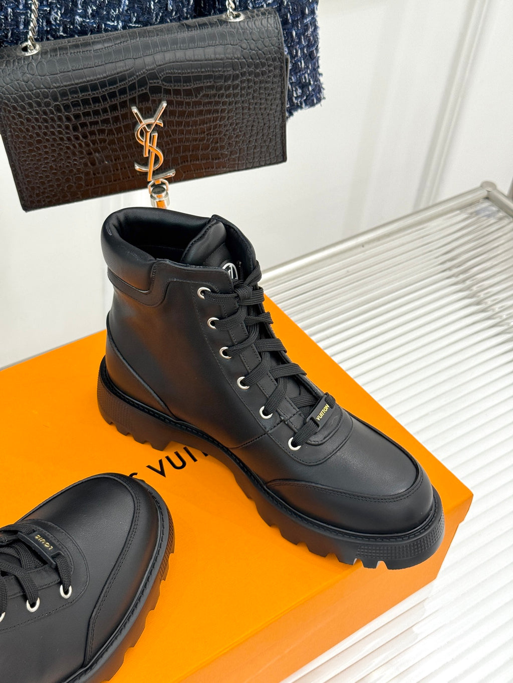 Black leather lace-up high ankle boots with front laces and round toe