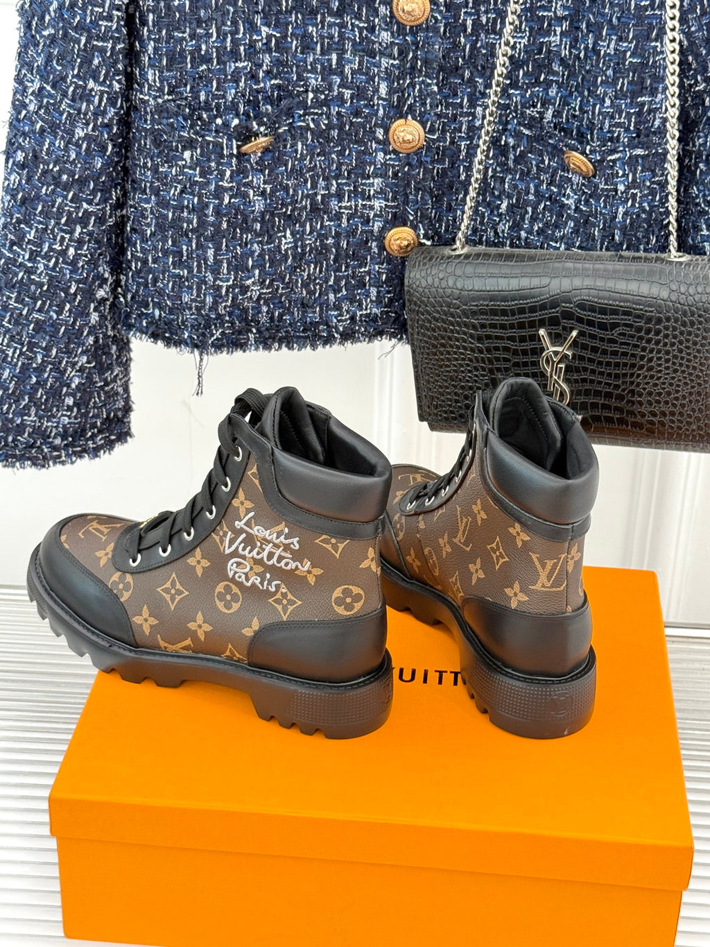 Monogram lace-up boots, dark brown upper with black trim and rugged tread sole