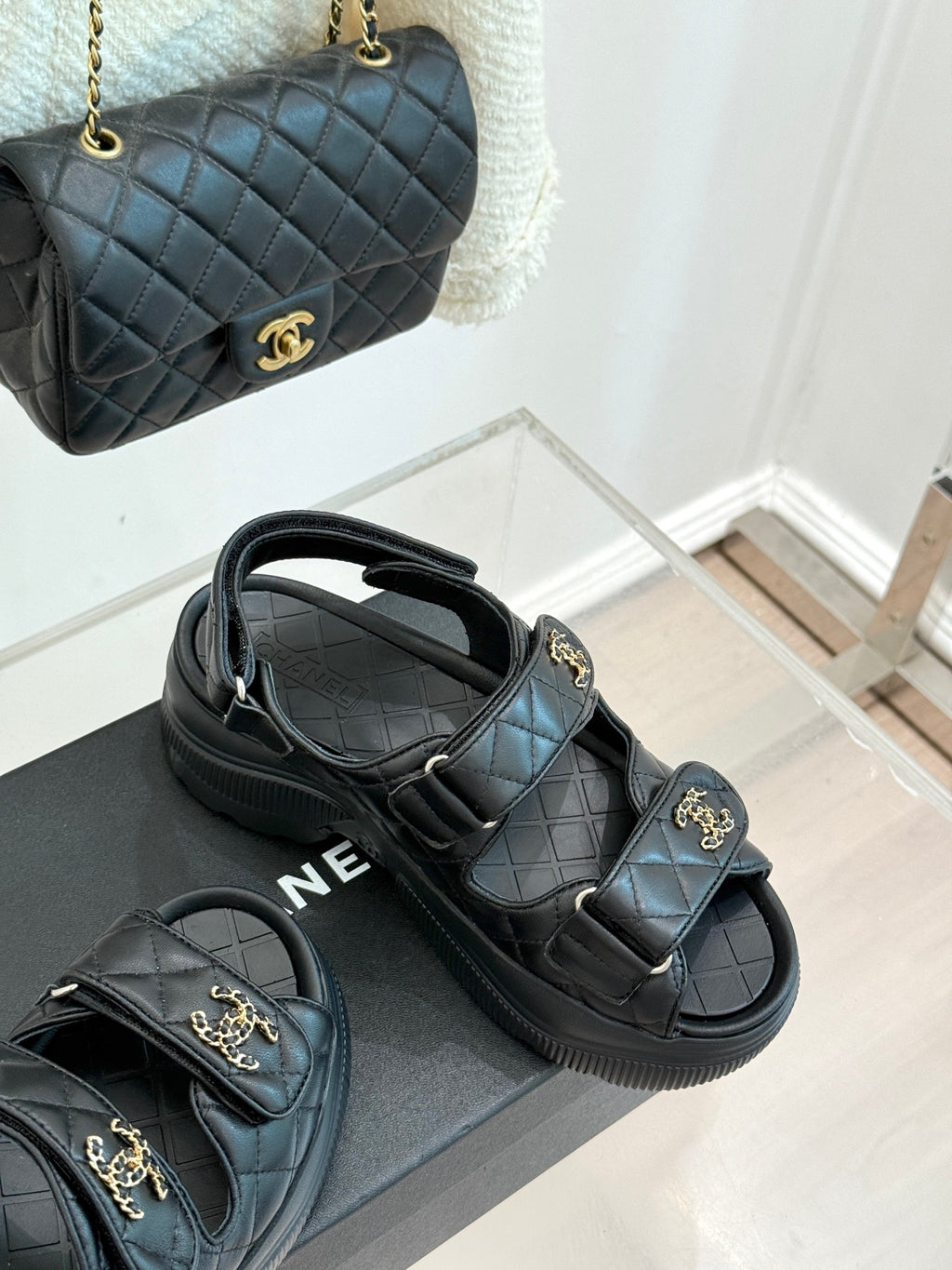 Chanel dark quilted slide sandals with double velcro straps and gold CC charms