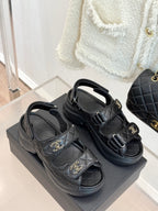 Chanel dark platform sandals with two adjustable buckle straps and gold CC emblems