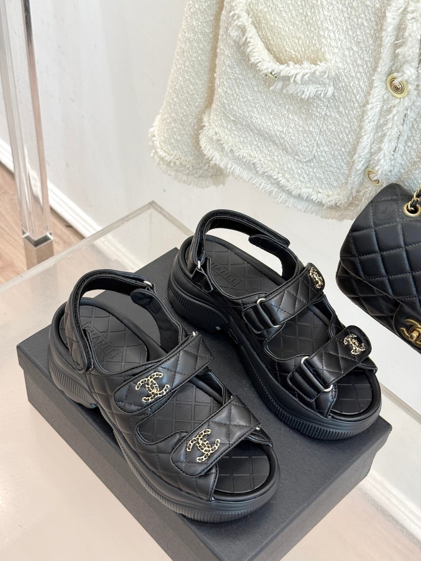 Chanel dark platform sandals with two adjustable buckle straps and gold CC emblems