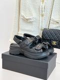 Chanel quilted leather slide sandals with double straps and gold CC emblems