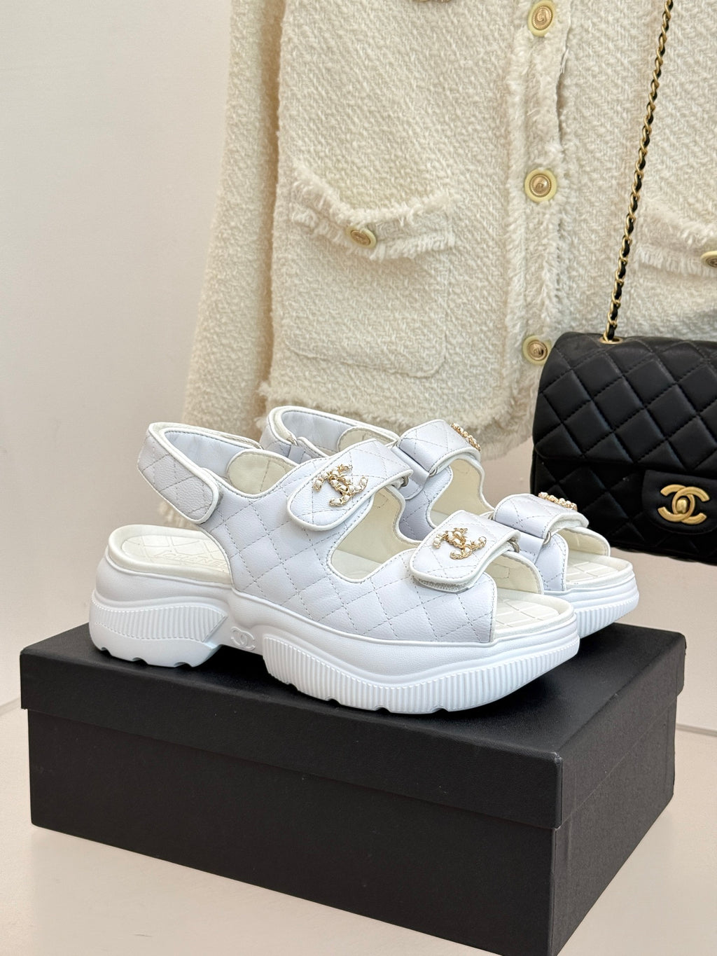 Chanel ladies white leather sandals with gold crest buckles and chunky rubber sole