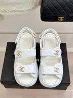 Chanel ladies white leather sandals with two gold logo buckles and thick rubber sole