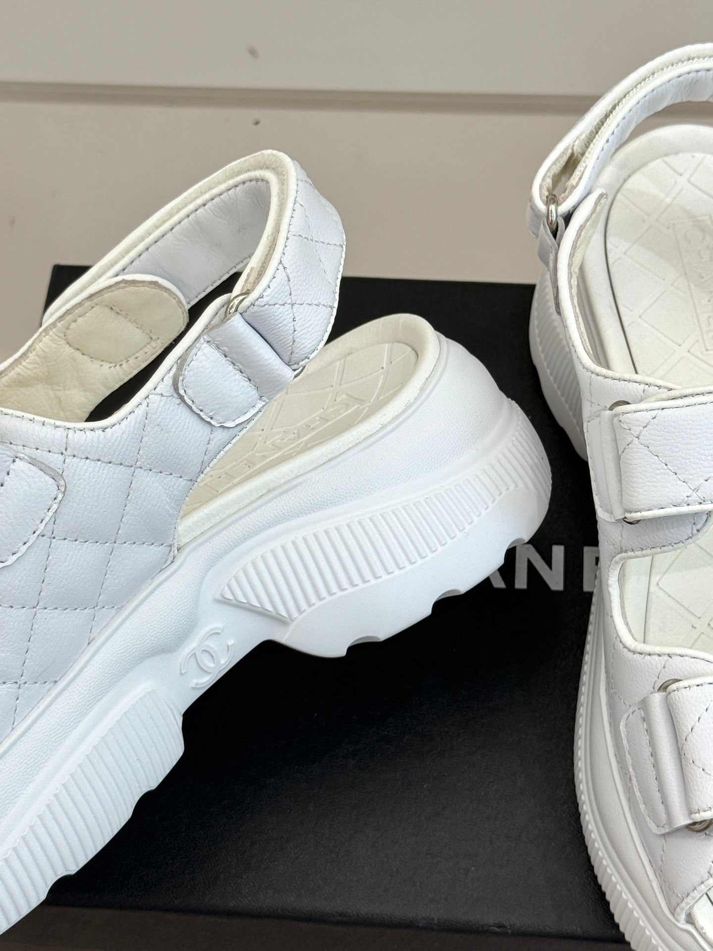 Chanel ladies white leather platform sandal showing textured sole and adjustable strap