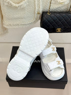 Chanel ladies white leather sandals with gold logo buckles and patterned outsole