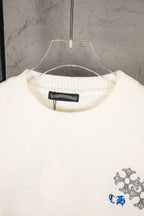 White knit sweater neckline with brand label and small right-chest crest