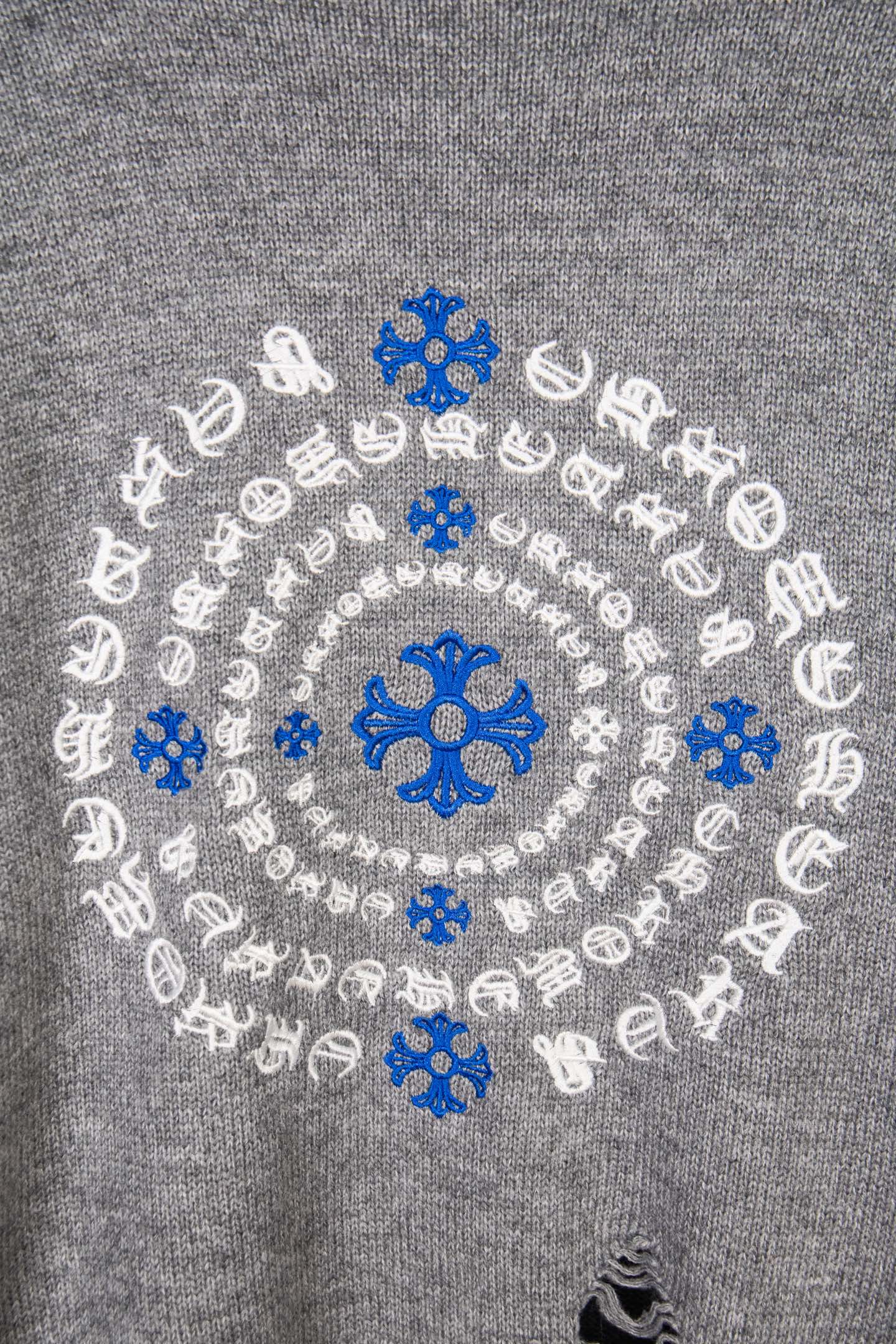 Grey knit sweater back embroidery with blue snowflakes and white pattern