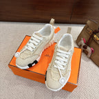 Hermes fabric sneakers, light beige knit upper, white laces, and chunky white sole