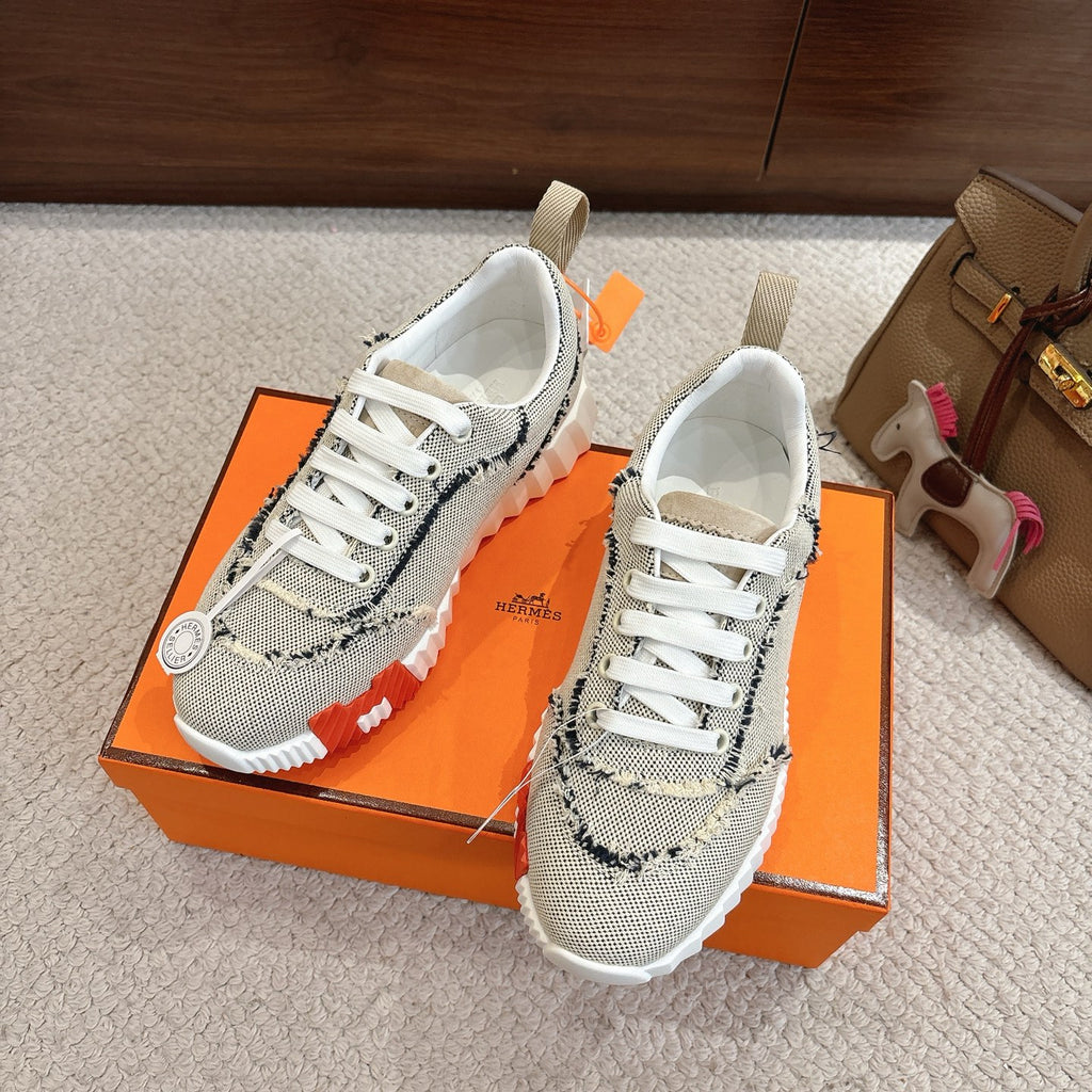 Hermes sneakers, light mesh with navy trim and white laces; thick white outsole.