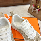 Hermes unisex sneakers, upper and laces detail with tan mesh side stripe and padded collar.
