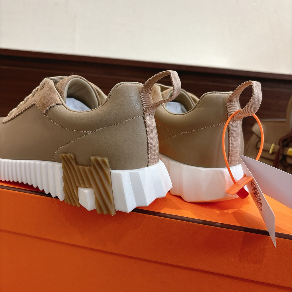 Beige suede sneakers showing rear and side, white platform sole with tread blocks