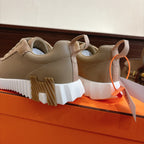 Beige suede sneakers showing rear and side, white platform sole with tread blocks