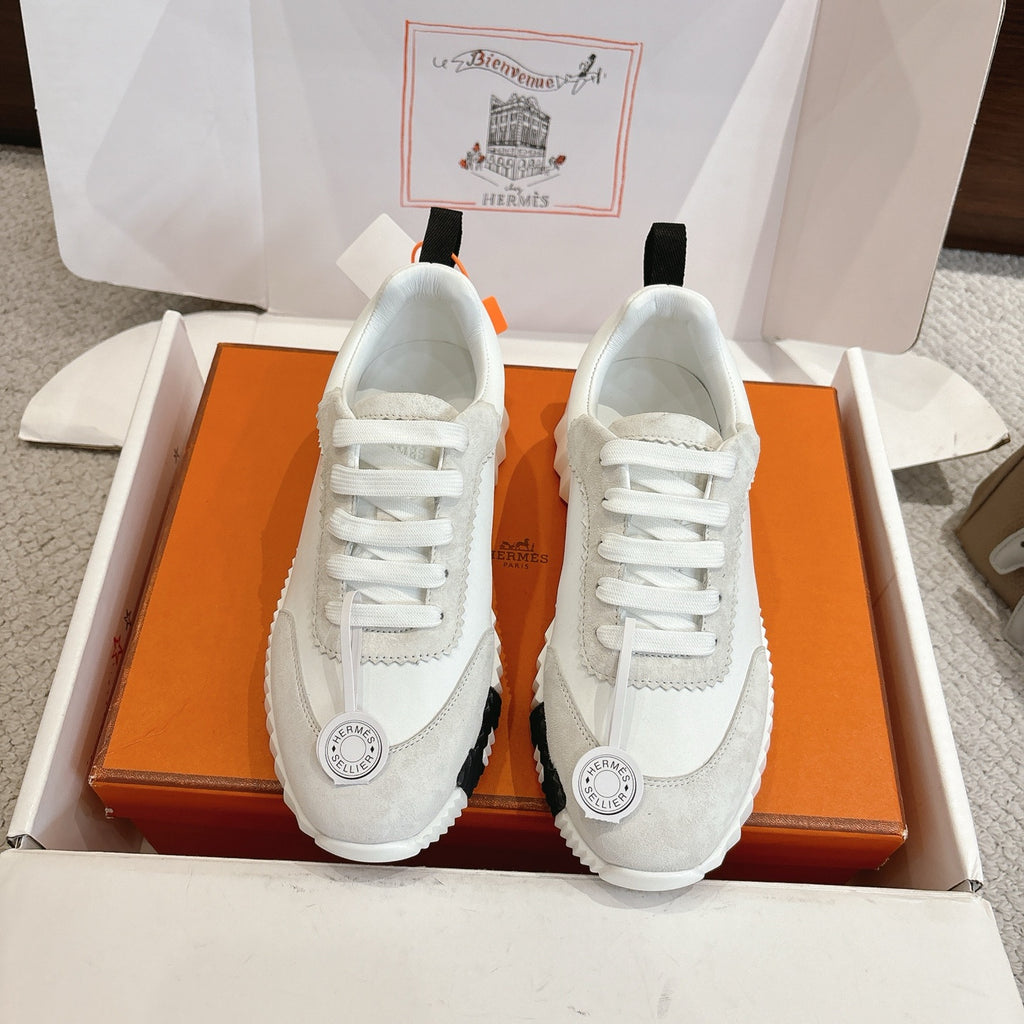 Hermes white unisex sneakers with white laces, black heel tab, chunky sole