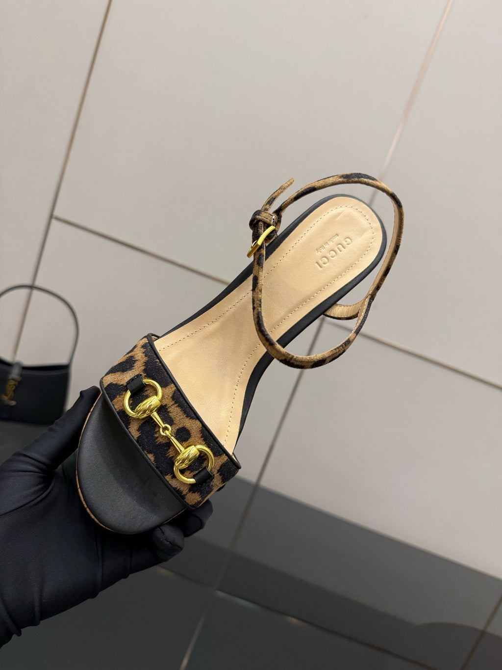 Gucci ladies platform sandal with leopard-print ankle strap and tan interior
