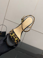 Gucci ladies platform sandal with leopard-print ankle strap and tan interior