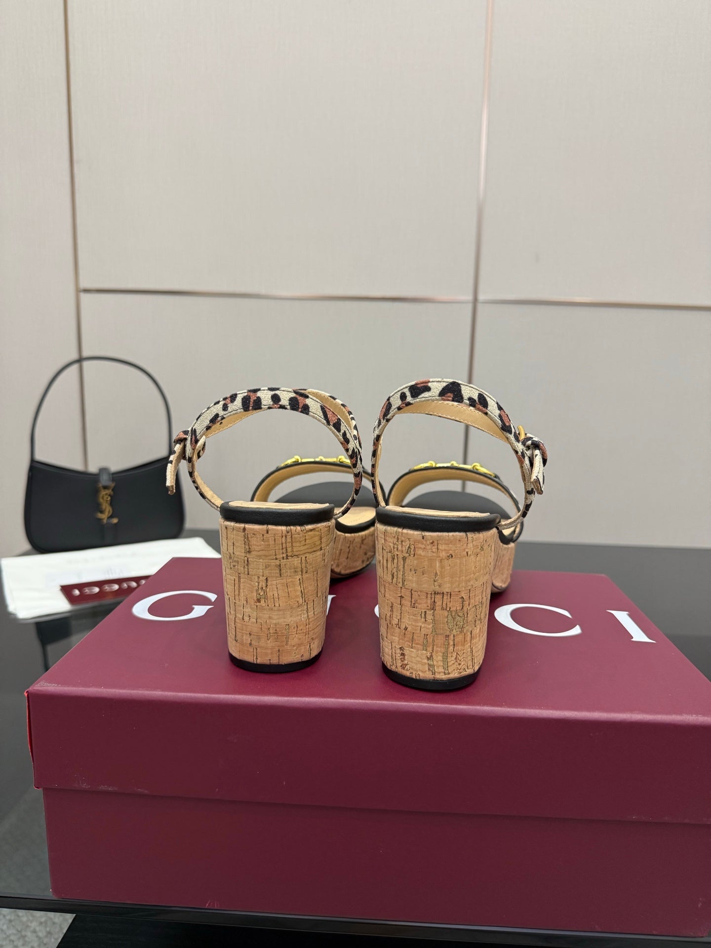 Leopard-print wedge sandals with cork heels, viewed from the back