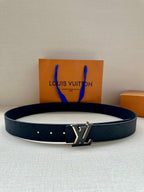Louis Vuitton belt with dark textured leather strap and gold-tone LV buckle