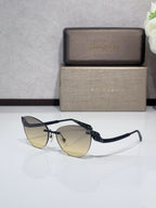 Sunglasses with black frames and dark lenses, textured patterned temples