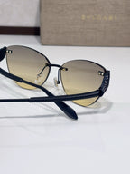 Navy-blue aviator sunglasses with gold-tinted lenses and beaded textured arms