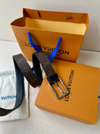 Louis Vuitton monogram belt set with two dark straps and silver buckles