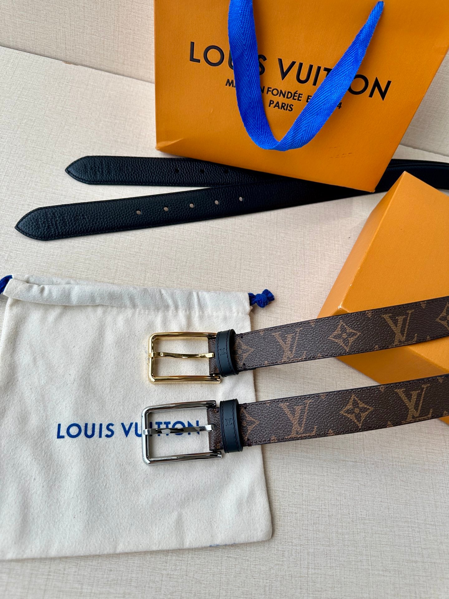 Louis Vuitton monogram belt with two dark straps and silver buckles, with dust bag