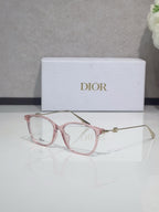 Dior glasses with rose pink acetate frames and gold metal temples, clear lenses
