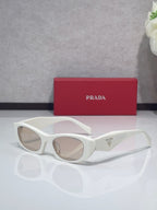 Cat-eye glasses with white frames and clear lenses