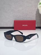 Cat-eye glasses with dark frames and brown-tinted lenses
