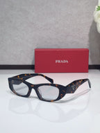 Cat-eye glasses with dark tortoiseshell frames and clear lenses