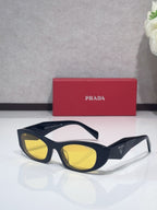 Cat-eye glasses with navy frames and yellow lenses